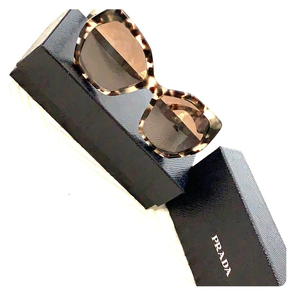 Tortoise shell Prada sunglasses.
